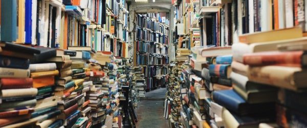 Collection of stacked books in a library