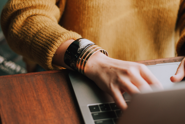 Woman typing on a laptop